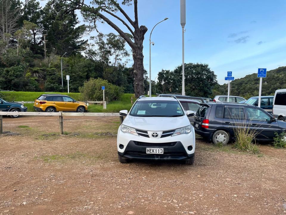 The author's rental car in the parking lot on Waiheke Island, New Zealand.