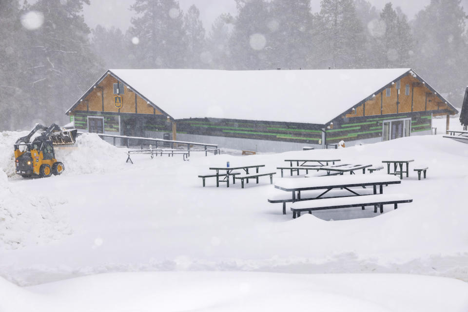 In this photo provided by Big Bear Mountain Resort, snow falls at the resort in Big Bear, Calif., Saturday, Feb. 25, 2023. (Lee Stockwell/Big Bear Mountain Resort via AP)