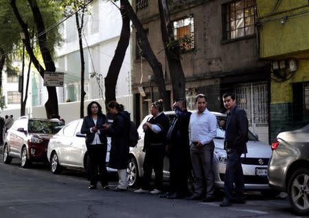 People gather outside after an earthquake was felt in Mexico City, Mexico July 19, 2018. REUTERS/Henry Romero