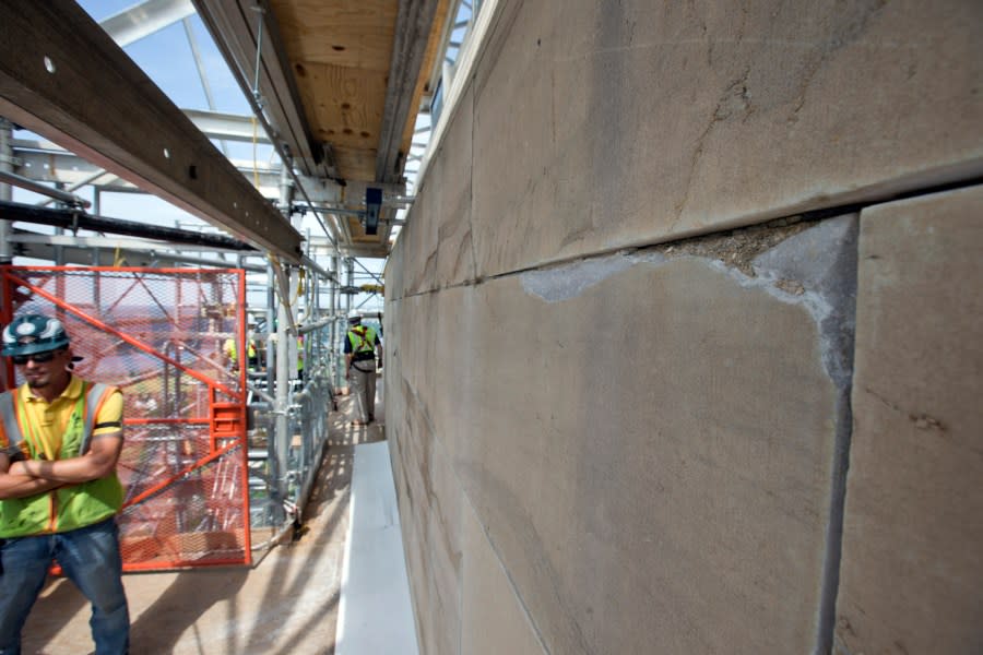 A missing corner of a stone is seen in the Washington Monument at the 491-foot level of the scaffolding surrounding the monument, Sunday, June 2, 2013 in Washington. The monument has been closed since the 2011 earthquake and half of the needed repairs have been funded by a $7.5 million donation from philanthropist David Rubenstein. The Associated Press had a look at some of the worst damage and the preparations underway to begin making repairs. Stone by stone, engineers are reviewing cracks, missing pieces and broken mortar now that huge scaffolding has been built around the towering symbol of the nations capital. Once each trouble spot is identified, repairs can begin. (AP Photo/Alex Brandon)