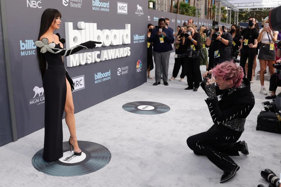 MGK takes pretend photos of Megan Fox on the red carpet (Getty Images)