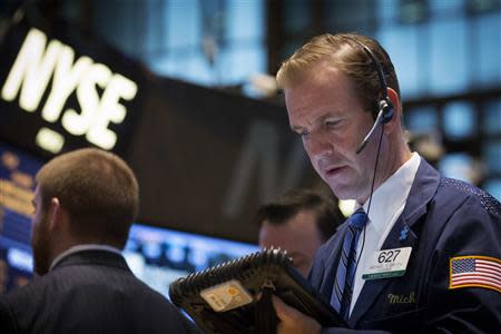 Traders work on the floor of the New York Stock Exchange (NYSE) October 23, 2013. REUTERS/Brendan McDermid