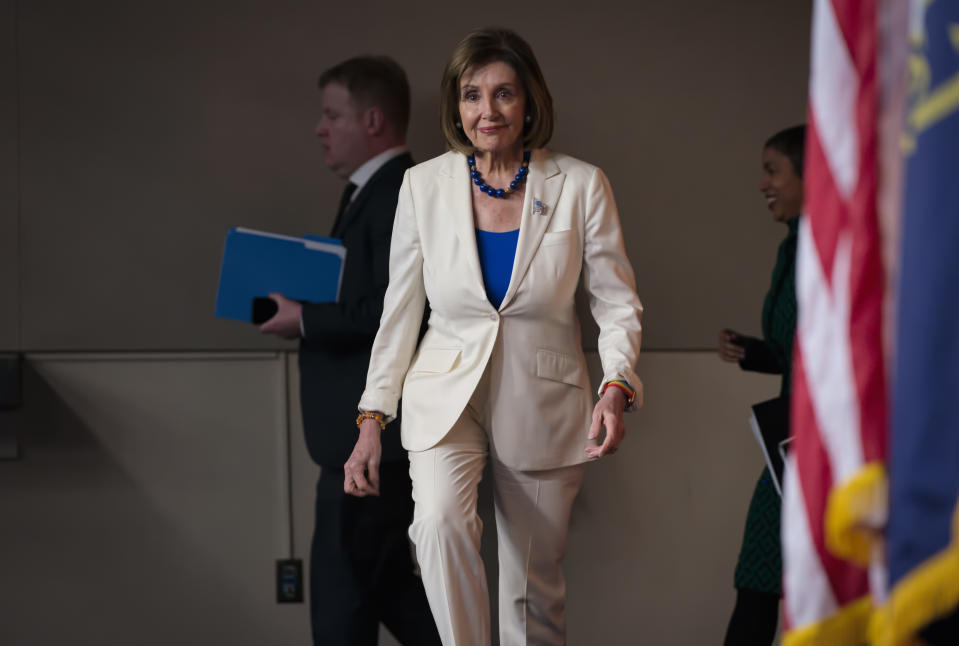 Speaker of the House Nancy Pelosi, D-Calif., arrives to talk to reporters as the House Intelligence Committee holds public impeachment hearings of President Donald Trump's efforts to tie U.S. aid for Ukraine to investigations of his political opponents. Pelosi says there is clear evidence that President Donald Trump has used his office for his personal gain. She says doing that "undermined the national security of the United States." (AP Photo/J. Scott Applewhite)