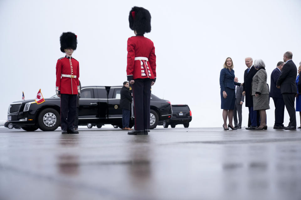 President Joe Biden speaks with Kirsten Hillman, Canada's ambassador to the United States, left in blue, and Canada's Gov. Gen. Mary Simon, second from right,as Biden arrives at Ottawa International Airport, Thursday, March 23, 2023, in Ottawa, Canada. (AP Photo/Andrew Harnik)