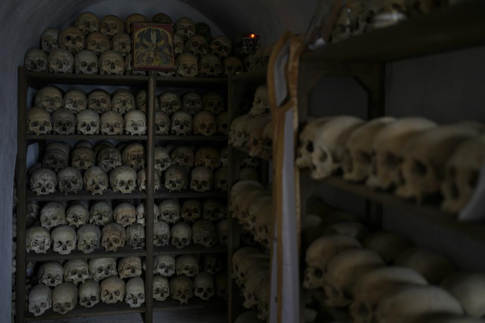 Skulls of monks darting to the 1400s are laid out on shelves in an ossuary at the Pantokrator Monastery, in the Mount Athos, northern Greece, on Thursday, Oct. 13, 2022. The monastic community was first granted self-governance through a decree by Byzantine Emperor Basil II, in 883 AD. Throughout its history, women have been forbidden from entering, a ban that still stands. This rule is called "avaton" and the researchers believe that it concerns every form of disturbance that could affect Mt. Athos. (AP Photo/Thanassis Stavrakis)