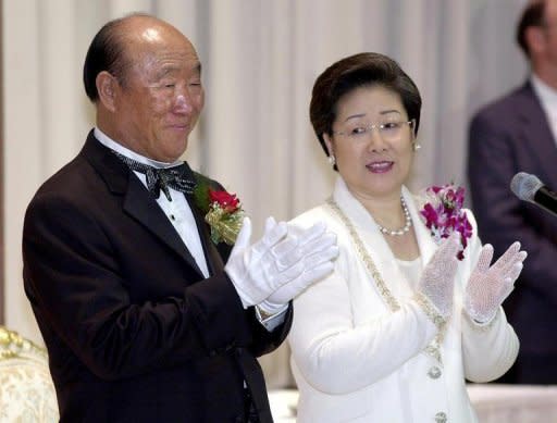 Sun Myung Moon (L) and his wife Hak Ja Han bless newlyweds during a mass wedding in New York in 2001. Moon, the self-styled messiah from South Korea who founded the controversial Unification Church, died Monday at the age of 92