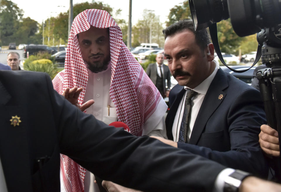 Saudi Arabia's top prosecutor Saud al-Mojeb reacts to journalists as he boards a plane to leave Turkey, in Istanbul, Wednesday, Oct, 31, 2018. A top Turkish prosecutor said Wednesday that Saudi journalist Jamal Khashoggi was strangled as soon as he entered the Saudi Consulate in Istanbul as part of a premeditated killing, and that his body was dismembered before being disposed of. A statement from chief Istanbul prosecutor Irfan Fidan's office also said that discussions with Saudi chief prosecutor Saud al-Mojeb have yielded no "concrete results" despite "good-willed efforts" by Turkey to uncover the truth.(DHA via AP)