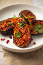 <p>This vegan-friendly centrepiece is super simple but looks oh-so impressive served up on a platter.</p><p><strong>Recipe: <a href="https://www.goodhousekeeping.com/uk/food/recipes/a27482624/harissa-aubergine/" rel="nofollow noopener" target="_blank" data-ylk="slk:Harissa aubergine;elm:context_link;itc:0;sec:content-canvas" class="link ">Harissa aubergine</a></strong></p>