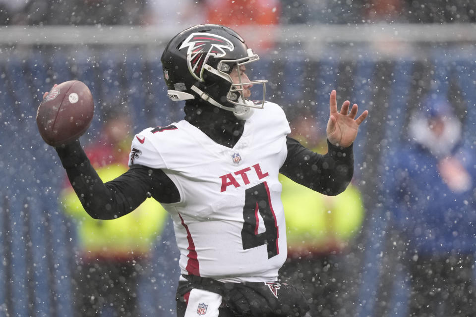 Atlanta Falcons quarterback Taylor Heinicke (4) sets back to pass in the first half of an NFL football game against the Chicago Bears in Chicago, Sunday, Dec. 31, 2023. (AP Photo/Charles Rex Arbogast)