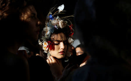 A model waits for the rehearsal of Christian Dior's Haute Couture Spring-Summer 2017 live show to celebrate Dior's new flagship store at the rooftop of Ginza Six mall in Tokyo, Japan, April 19, 2017. REUTERS/Toru Hanai