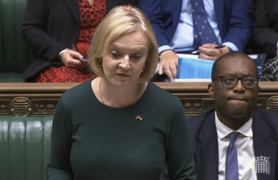 In this grab taken from video, Britain's Prime Minister Liz Truss delivers a speech in the House of Commons,to set out her energy plan to shield households and businesses from soaring energy bills, in London, Thursday, Sept. 8, 2022. Truss says her government will cap domestic energy prices for homes and businesses to ease the cost-of-living crisis. Truss told lawmakers Thursday that the two-year “energy price guarantee” means average household bills will be no more than 2,500 pounds ($2,872) a year for heating and electricity. (House of Commons/PA via AP)