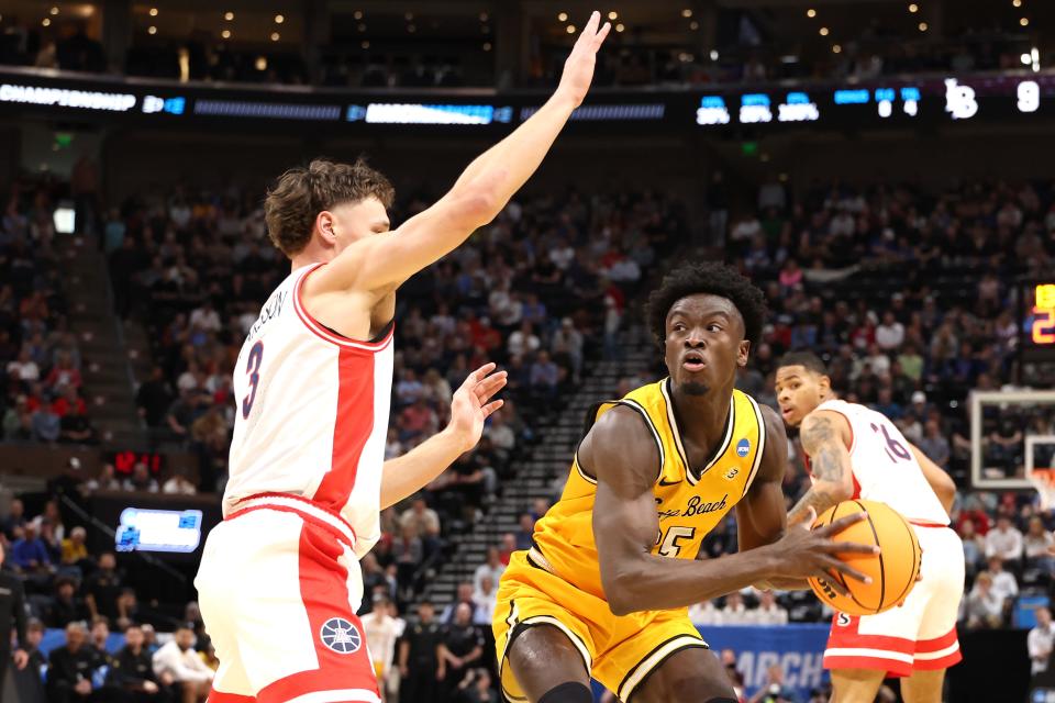 Pelle Larsson #3 of the Arizona Wildcats defends against Aboubacar Traore #25 of the Long Beach State 49ers during the first half in the first round of the NCAA Men's Basketball Tournament at Delta Center on March 21, 2024, in Salt Lake City, Utah.