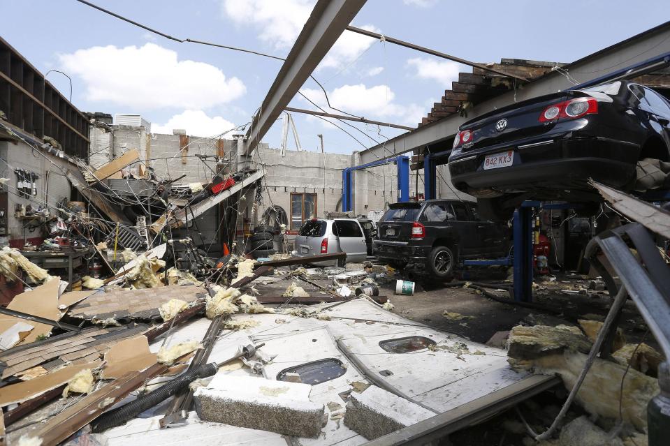 A collapsed roof is seen with damaged automobiles at a car workshop on Herman Street in Revere, Massachusetts, July 28, 2014. Police and emergency crews in Revere, outside Boston scrambled to clean up after a rare tornado touched down on Monday, downing power lines, damaging homes and overturning at least one car.The National Weather Service confirmed that a tornado touched down during a storm that brought heavy rains, lightning and flooding to Boston and many of its northern suburbs. State emergency management officials said they were not aware of major injuries or fatalities from the storm. (REUTERS/Dominick Reuter)