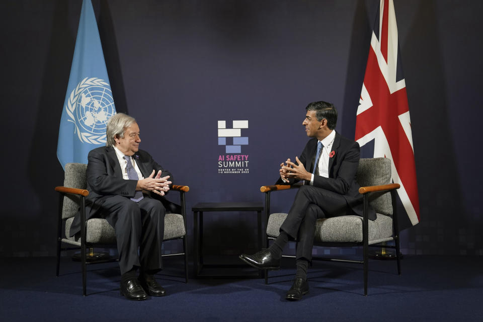 Britain's Prime Minister Rishi Sunak, right, speaks with UN Secretary General, Antonio Guterres, on the second day of the UK Artificial Intelligence (AI) Safety Summit, at Bletchley Park, in Bletchley, England, Thursday, Nov. 2, 2023. U.S. Vice President Kamala Harris and British Prime Minister Rishi Sunak are set to join delegates Thursday at a U.K. summit focused on containing risks from rapid advances in cutting edge artificial intelligence. (Joe Giddens/Pool Photo via AP)
