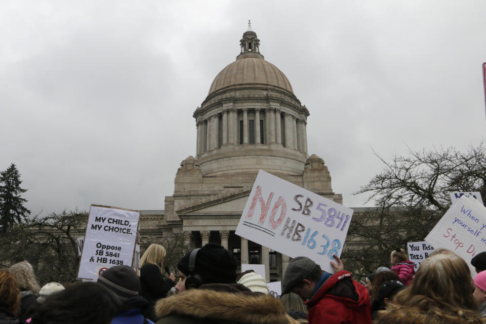 Opponents to efforts to remove philosophical exemptions from school vaccine requirements rally outside the Washington Capitol in Olympia in February. (ASSOCIATED PRESS)