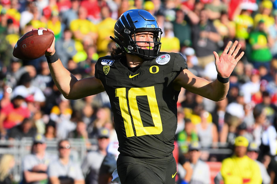 Oregon's Justin Herbert is a more traditional pocket passer, but he can still move and is a lock to go in the top 10 of April's draft, according to scouts. (Photo by Brian Rothmuller/Icon Sportswire via Getty Images)