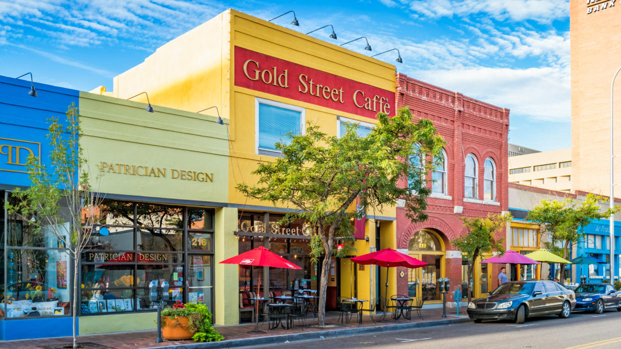 Colorful store facades and cafe in downtown Albuquerque, New Mexico, USA on a sunny day.