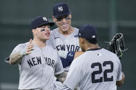New York Yankees left fielder Alex Verdugo, left, center fielder Aaron Judge and right fielder Juan Soto (22) celebrate after an opening-day baseball game against the Houston Astros, Thursday, March 28, 2024, in Houston. (AP Photo/Kevin M. Cox)