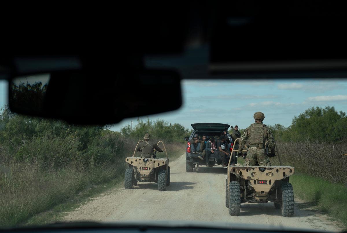 Texas DPS special agents take a group of five undocumented migrants from Honduras that were caught in private property as part of Operation Lone Star in Kinney County near Brackettville, Texas on Nov. 8, 2021. The owner of the property did not sign an affidavit for arrests of undocumented migrants to be taking place at their property so the group will be processed by Border Patrol instead.