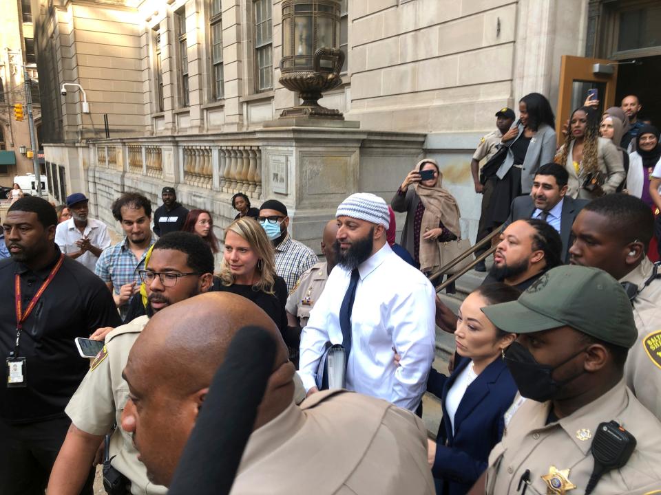 Adnan Syed, center, leaves the Elijah E. Cummings Courthouse on Monday, Sept. 19, 2022, in Baltimore. A judge has ordered the release of Syed after overturning his conviction for a 1999 murder that was chronicled in the hit podcast “Serial.”