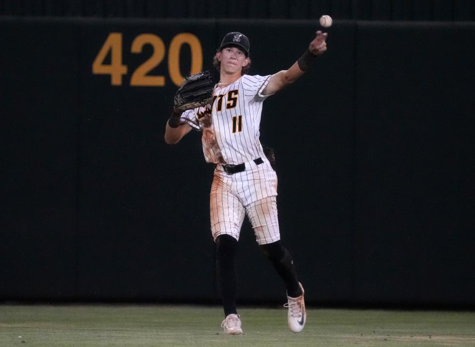 Saguaro Sabercats' Cam  Caminiti (11) throws the ball in from center field against the Canyon del Oro Dorados during their 4A State Championship game at Tempe Diablo Stadium on May 15, 2023.
