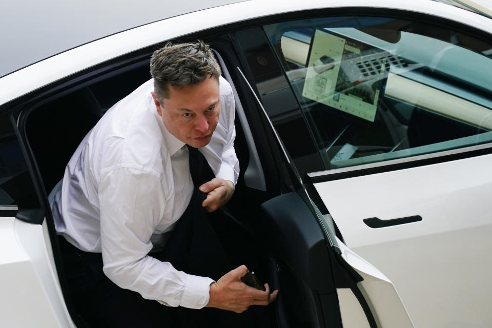 Elon Musk arrives at the justice center in Wilmington, Del., Tuesday, July 13, 2021. Musk took to a witness stand Monday to defend his company's 2016 acquisition of a troubled company called SolarCity against a shareholder lawsuit that claims he's to blame for a deal that was rife with conflicts of interest and never delivered the profits he had promised. (AP Photo/Matt Rourke)