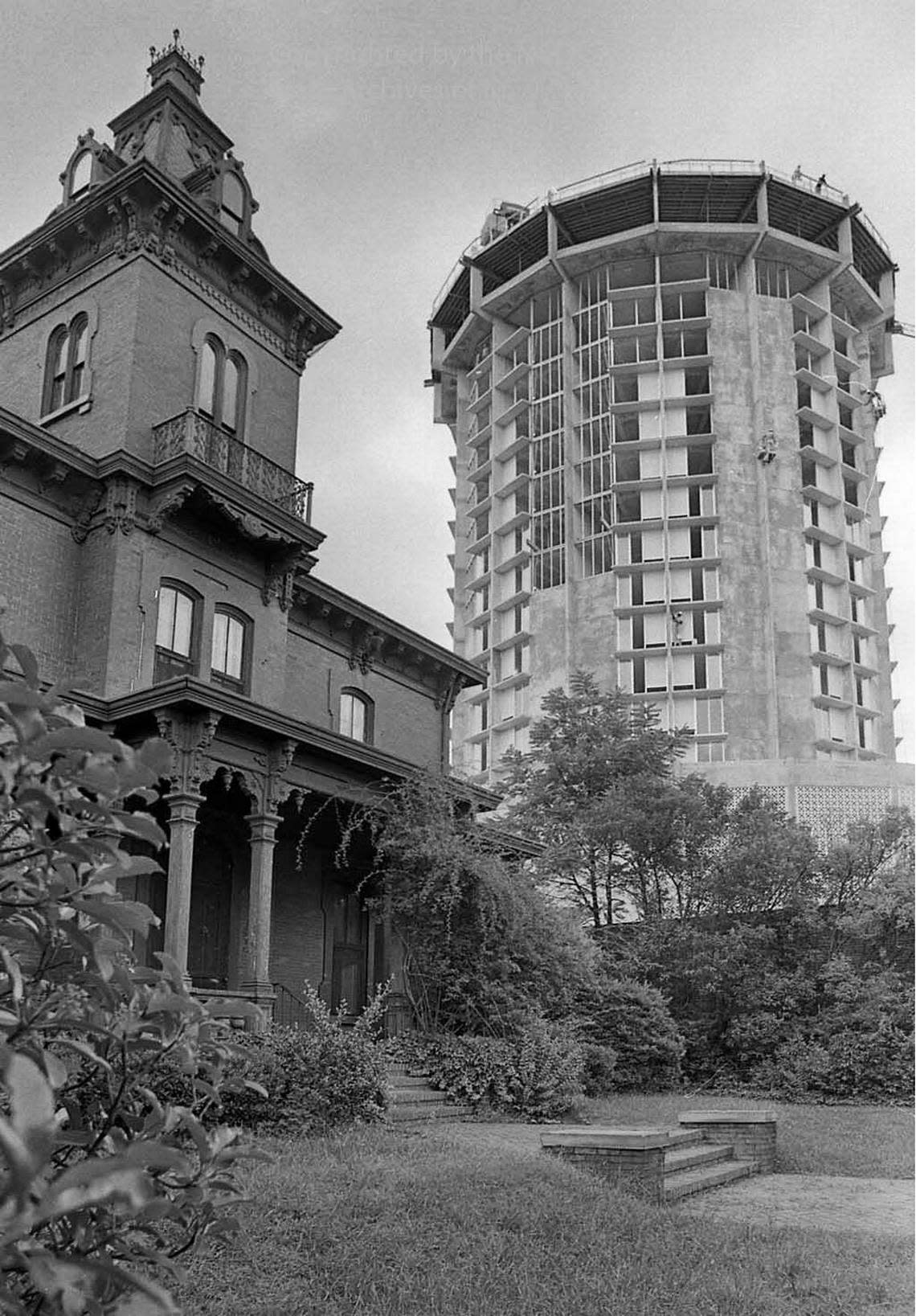 The Dodd-Hinsdale house is seen in the the foreground as workers build the Holiday Inn on Raleigh, N.C.’s Hillsborough Street July 31, 1969.