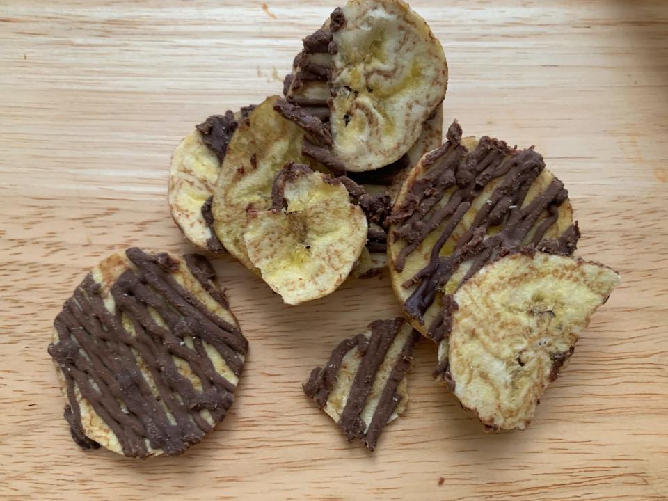 trader joe's dark chocolate plantain chips on wood counter