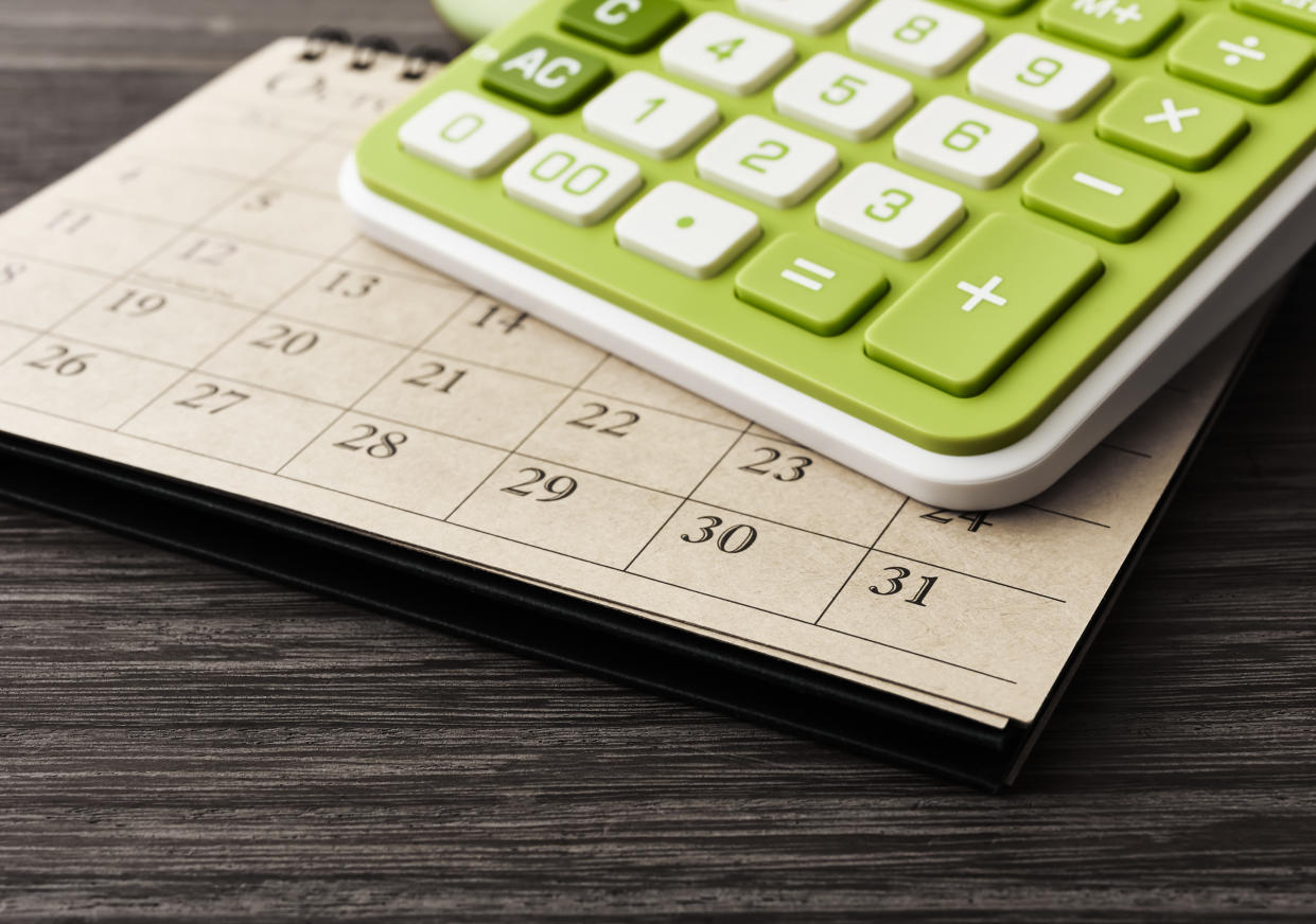  Green calculator on calendar. 