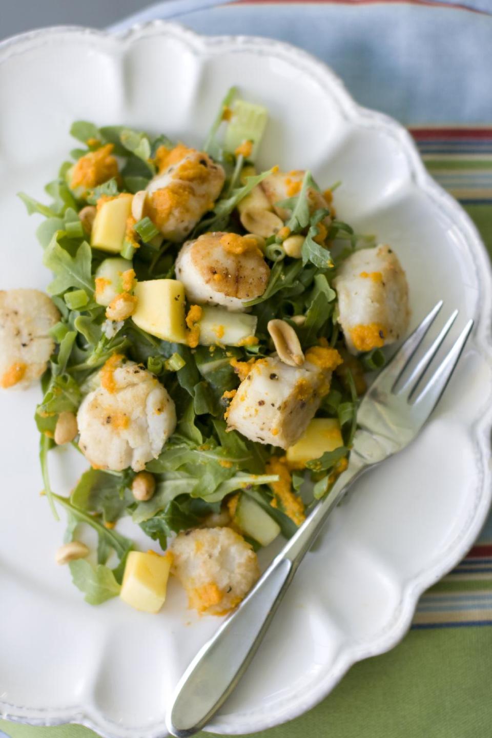 This July 15, 2013 photo shows a warm scallop salad with carrot-ginger dressing in Concord, N.H. (AP Photo/Mathew Mead)