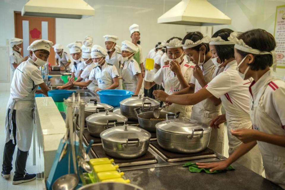 Children take part in a cookery lesson at Songdowon International School Children's Camp on August 22, 2018.