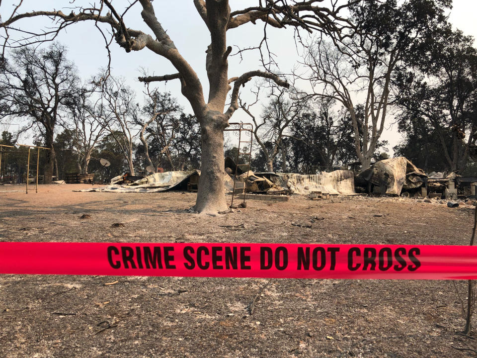 Police tape blocks the house where relatives say the great-grandmother and children were found. Source: AP