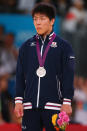 LONDON, ENGLAND - JULY 30: Silver medalist Riki Nakaya of Japan pose on the medal stand during the Men's -73 kg Judo on Day 3 of the London 2012 Olympic Games at ExCeL on July 30, 2012 in London, England. (Photo by Alexander Hassenstein/Getty Images)