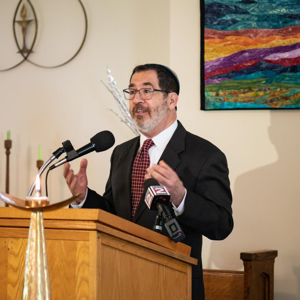 Rabbi Peter Schaktman of Temple Emanu-El speaks at Utica Unitarian Universalist Church on Thursday, May 25, 2023 to call for County Executive Anthony Picente Jr. to reverse his position stating that Oneida County will not accept asylum seekers as New York City overflows with people in acute need of safety. 