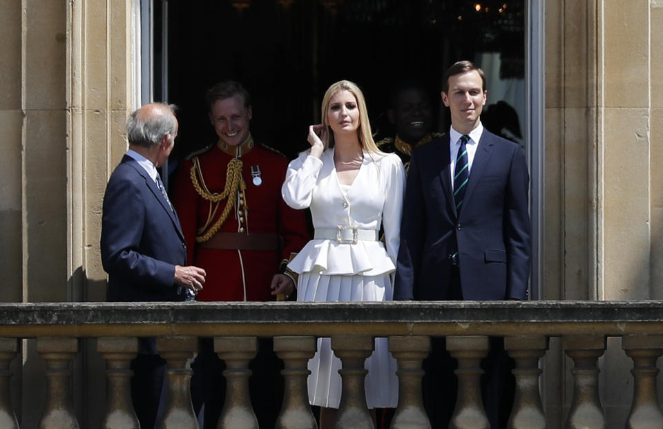 Jared Kushner, right, and Ivanka Trump, second right, watch from a window before a ceremonial welcome in the garden of Buckingham Palace in London for President Donald Trump and first lady Melania Trump, Monday, June 3, 2019 on the opening day of a three day state visit to Britain. (AP Photo/Frank Augstein)