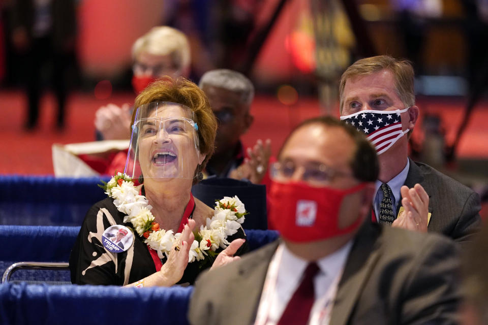 People applaud as President Donald Trump visits the Republican National Committee convention site, Monday, Aug. 24, 2020, in Charlotte. (AP Photo/Evan Vucci)