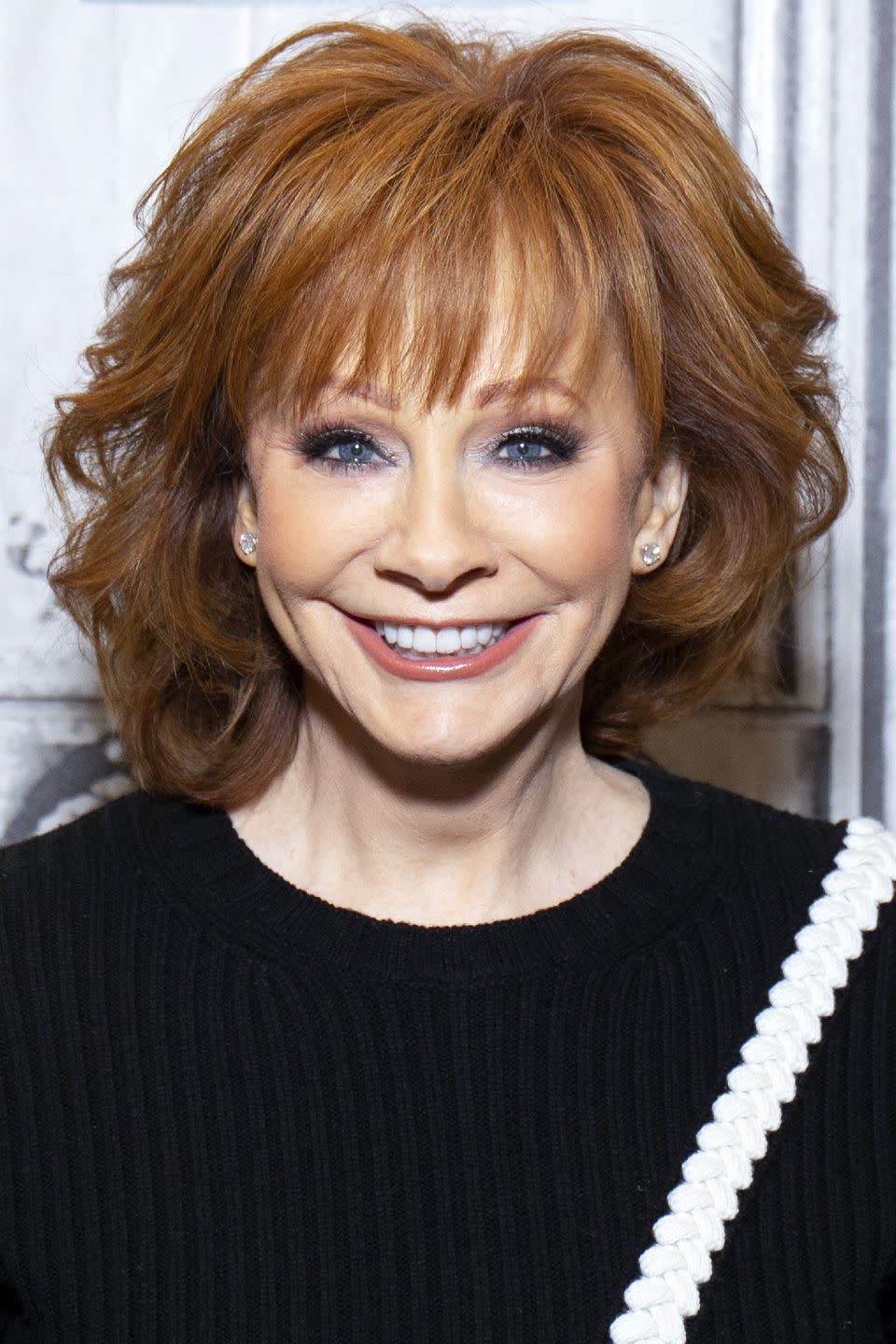 Reba McEntire: Layered Waves with Bangs