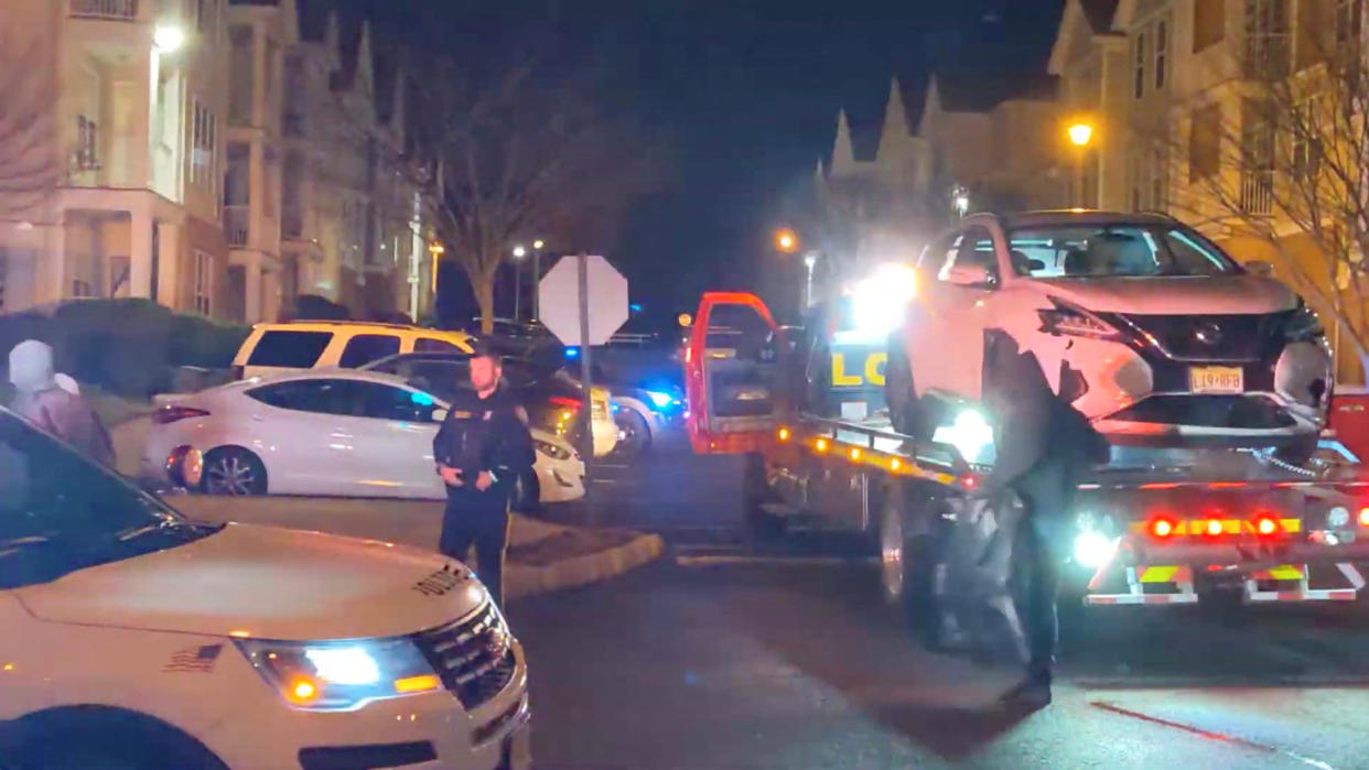 Dwumfour’s vehicle is seen loaded onto a tow truck.