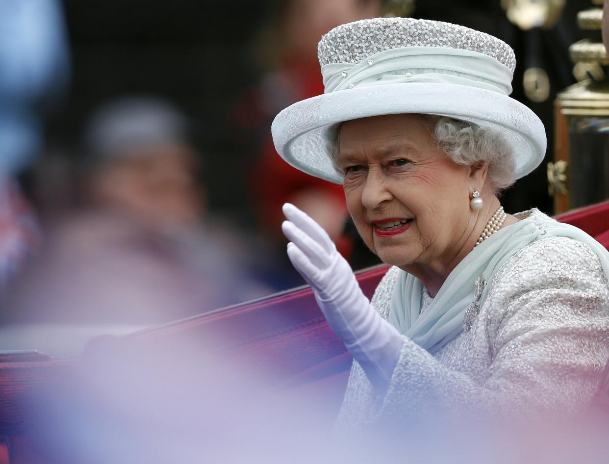 Queen Elizabeth II waves to spectators as she leaves Westminster Hall, London, during the Diamond Jubilee celebrations. PRESS ASSOCIATION Photo. Picture date: Tuesday June 5, 2012. See PA story ROYAL Jubilee. Photo credit should read: Kevin Coombs/PA Wire