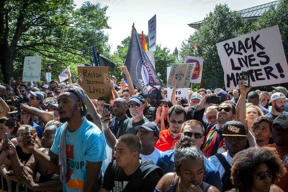 <p>Chet Strange/Getty Images</p> Counter protestors gather during a planned Ku Klux Klan protest on July 8, 2017 in Charlottesville, Virginia