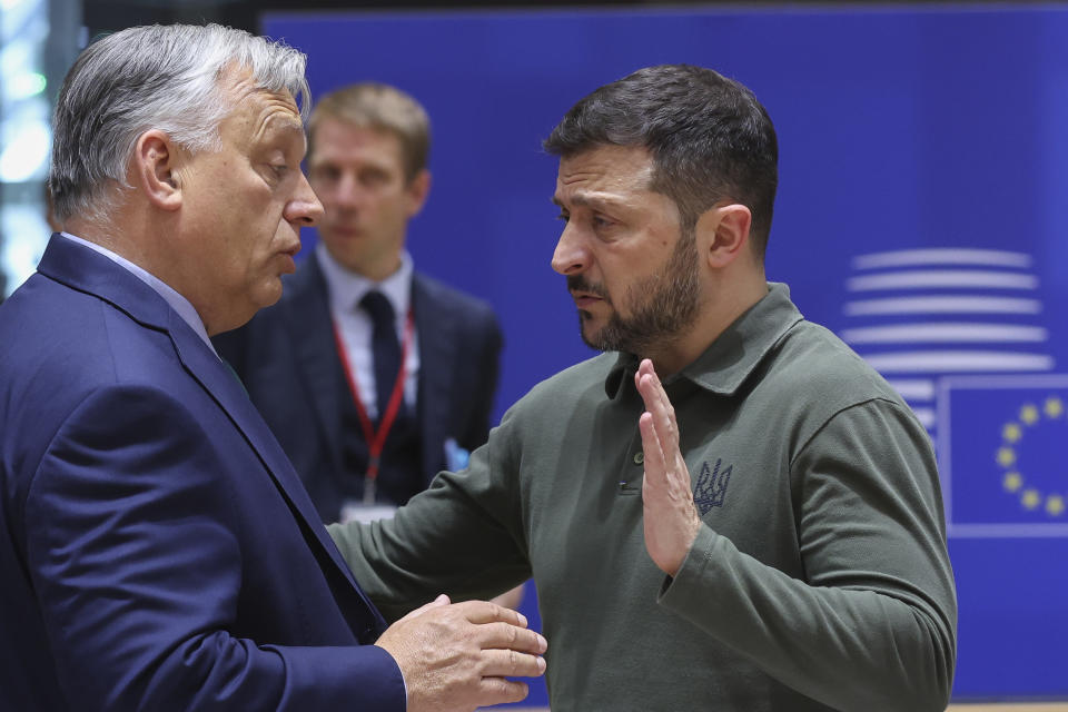 Ukraine's President Volodymyr Zelenskyy, right, speaks with Hungary's Prime Minister Viktor Orban during a round table meeting at an EU summit in Brussels, Thursday, June 27, 2024. European Union leaders are expected on Thursday to discuss the next EU top jobs, as well as the situation in the Middle East and Ukraine, security and defence and EU competitiveness. (Olivier Hoslet, Pool Photo via AP)