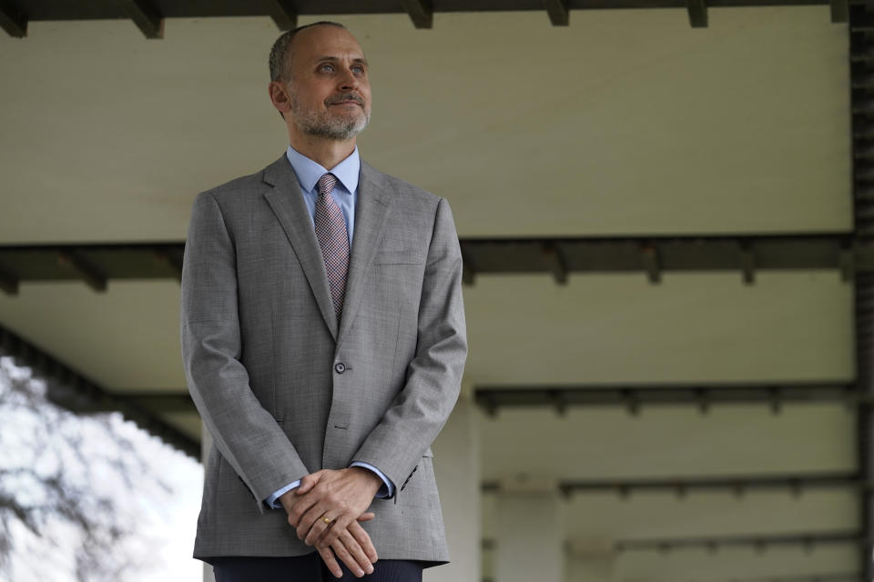 Kenneth Trzaska, President of Lewis & Clark Community College, poses for a photo on the college's campus Dec. 15, 2021, in Godfrey, Ill. The small Illinois school canceled classes for days after a ransomware attack last month that knocked critical computer systems offline. (AP Photo/Jeff Roberson)