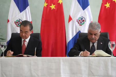 China's Foreign Minister Wang Yi and Dominican Republic's Chancellor Miguel Vargas sign a bilateral agreement in Santo Domingo, Dominican Republic September 21, 2018. REUTERS/Ricardo Rojas