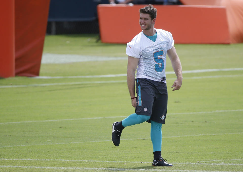 FILE - In this May 30, 2018, file photo, kicker Greg Joseph warms up during an NFL organized team activities football practice at the Miami Dolphins training facility in Davie, Fla. A person familiar with the decision says the Cleveland Browns will sign free agent kicker Greg Joseph to replace Zane Gonzalez, who missed four attempts in Sunday’s loss at New Orleans. Joseph was picked over several other kickers who in came in for tryouts on Monday, Sept. 17, 2018, said the person who spoke to The Associated Press on condition of anonymity because the team has not announced the signing. (AP Photo/Wilfredo Lee, File)