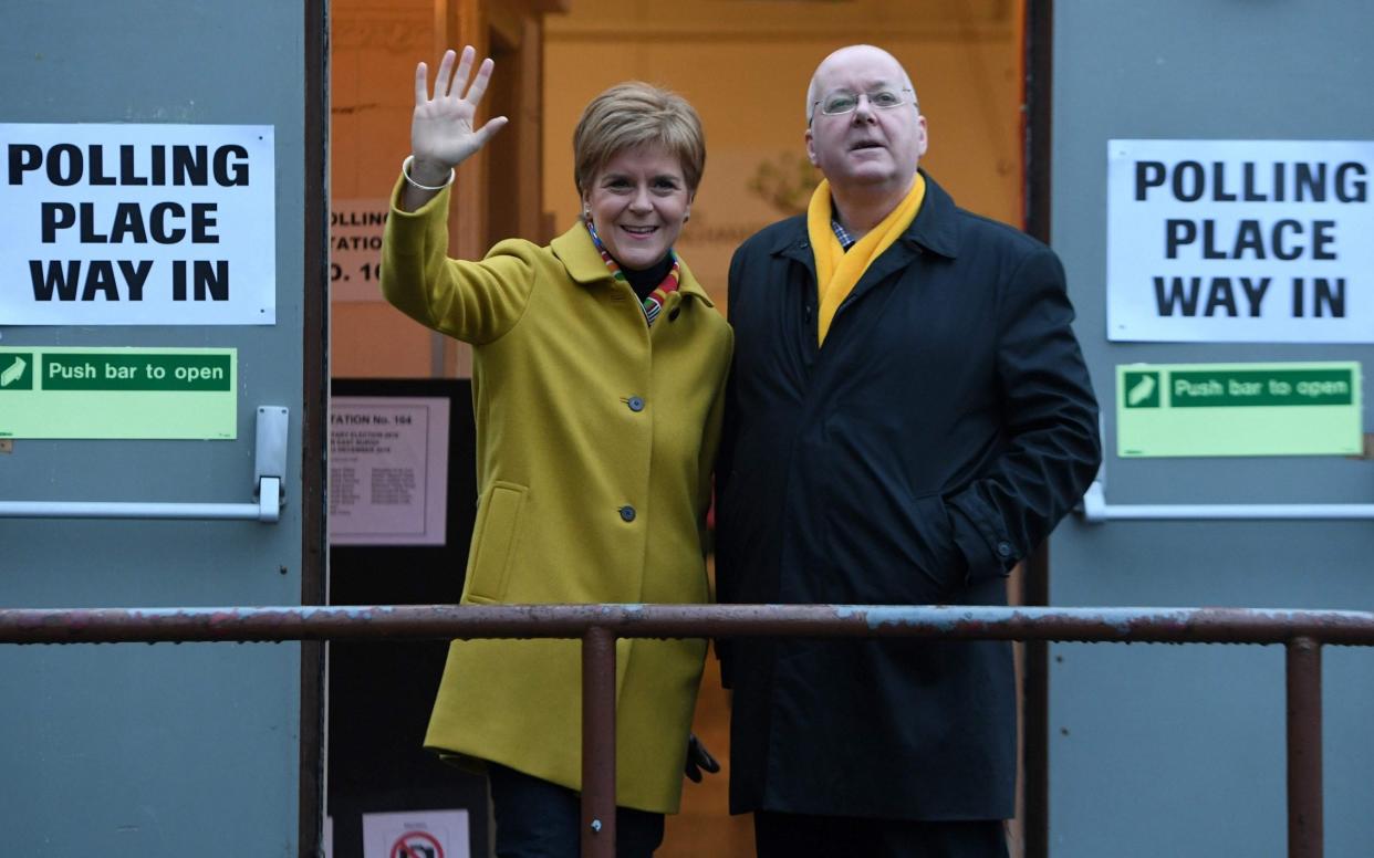 Nicola Sturgeon and her husband Peter Murrell, the SNP's chief executive - AFP