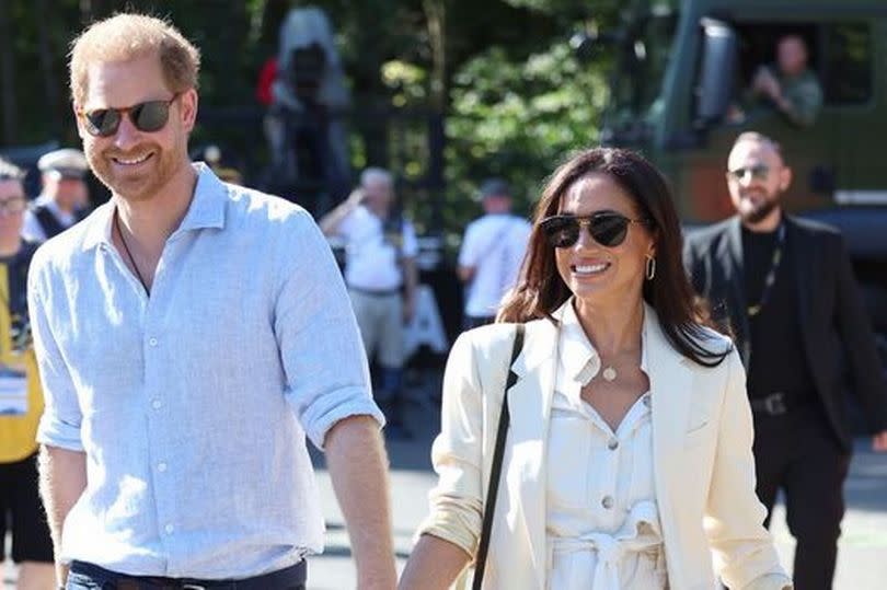 Prince Harry and Meghan Markle attend the cycling medal ceremony at the Cycling Track at the Invictus Games 2023