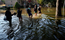 <p>Members of the Nguyen family return to their home for the first time since Harvey floodwaters arrived in north western Houston, Texas, Aug. 31, 2017. (Photo: Rick Wilking/Reuters) </p>