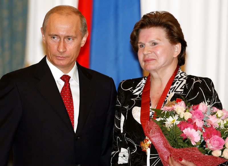 FILE PHOTO: Russian President Vladimir Putin and cosmonaut Valentina Tereshkova pose after a state award ceremony in Moscow