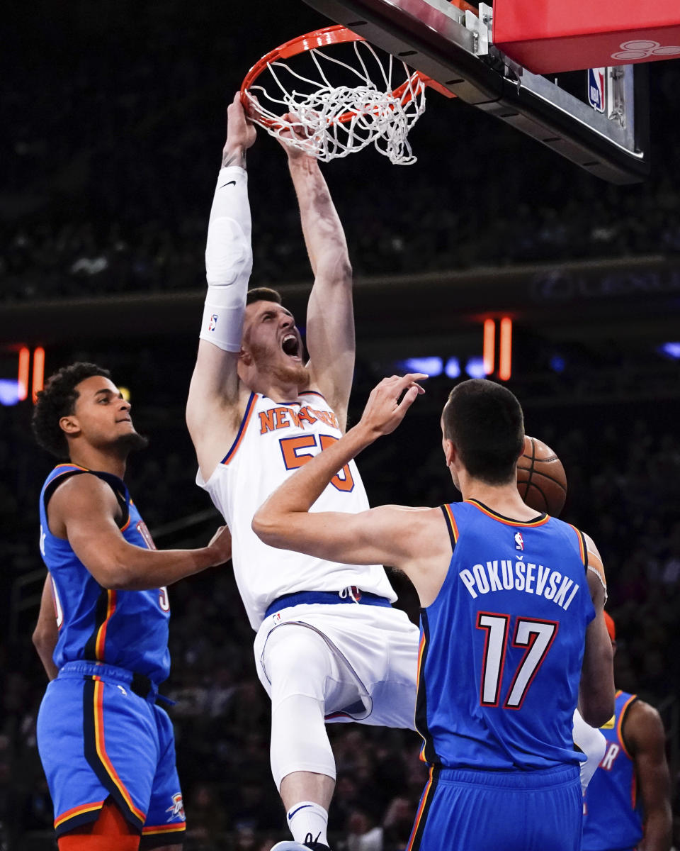 New York Knicks center Isaiah Hartenstein (55) slam dunks during the first half of an NBA basketball game against the Oklahoma City Thunder, Sunday, Nov. 13, 2022, in New York. (AP Photo/Julia Nikhinson)