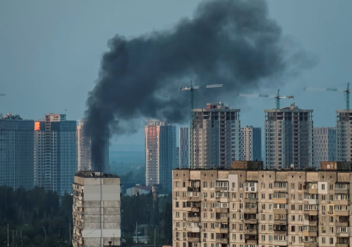 Smoke rises after a Russian missile strike in Kyiv (Reuters)